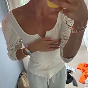 Free People top with puff sleeves and floral cut out detail
